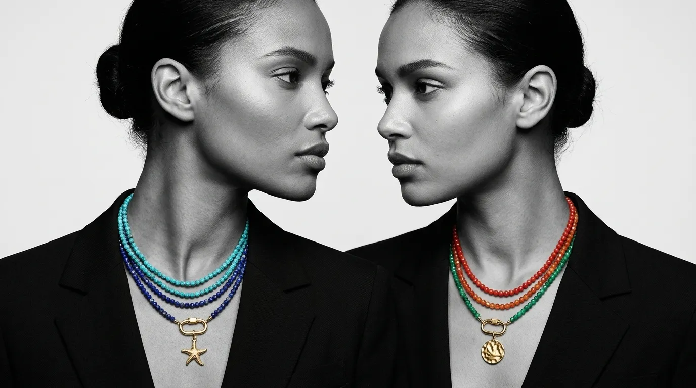 Two women in black and white wearing layered strands with starfish and medallion charms